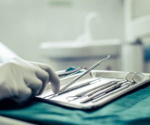Dentists choose equipment on the table.